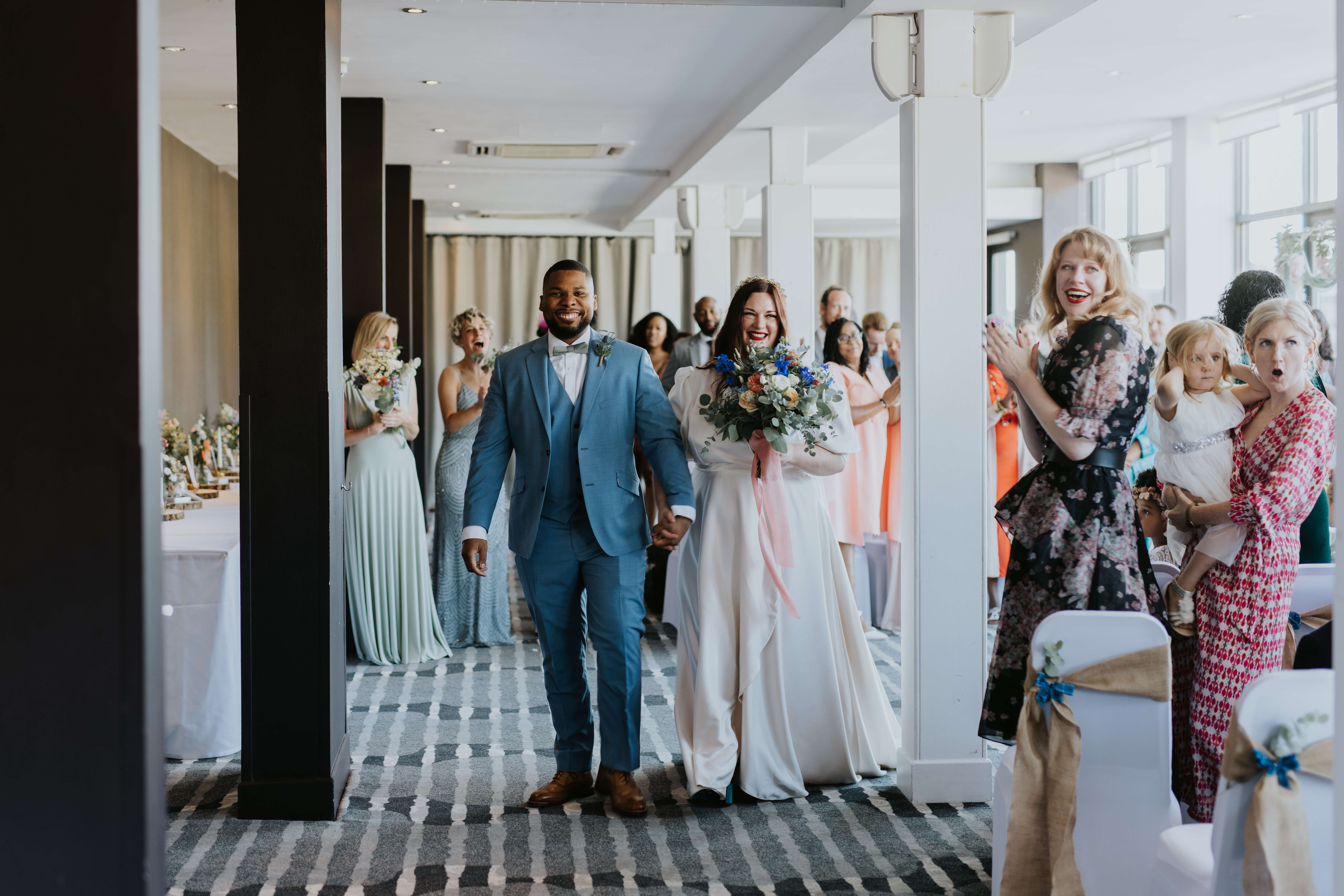 Couple Walking Back Up The Aisle
