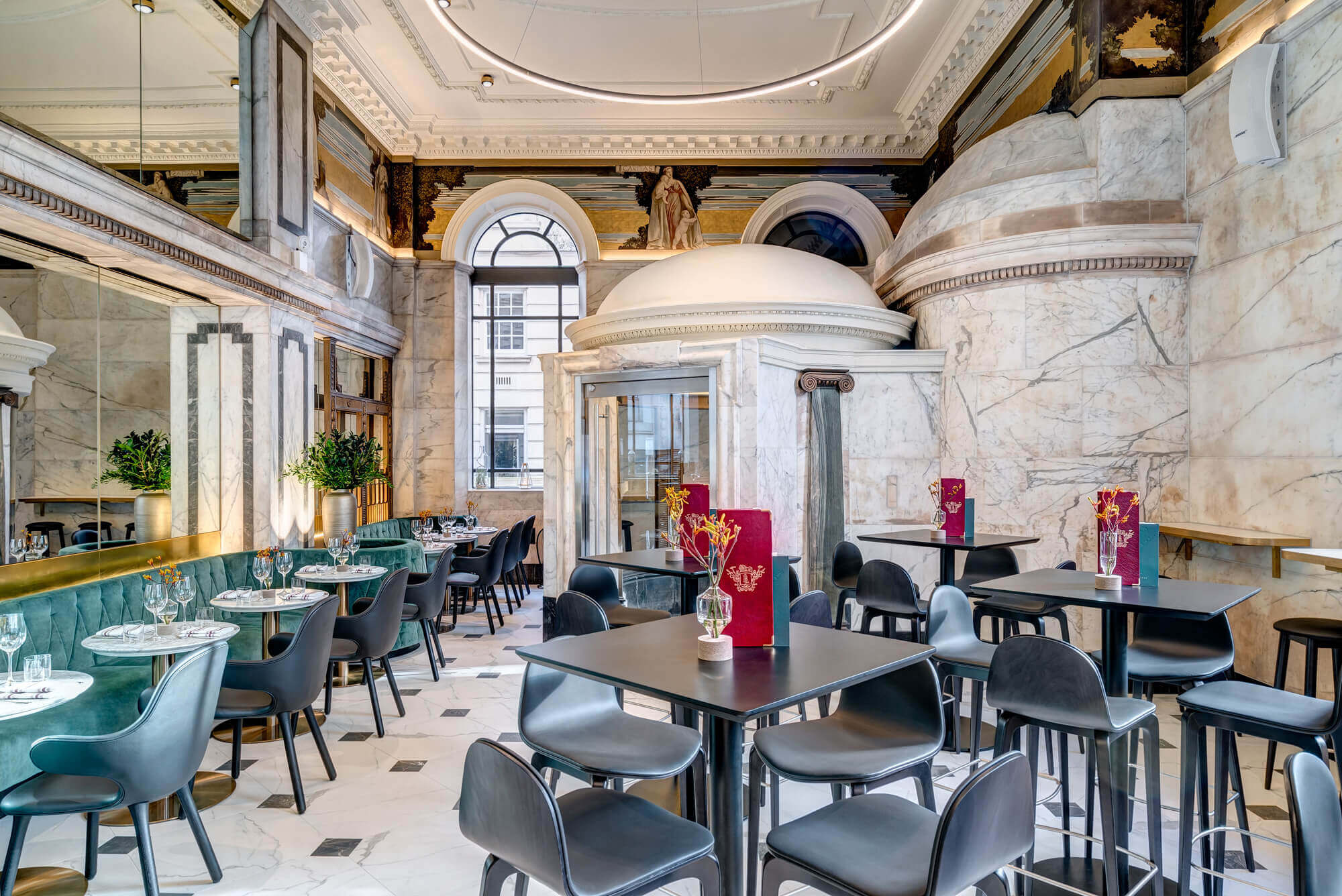 Empty Restaurant With Tables, Blue Velvet Seating & Marble Interior