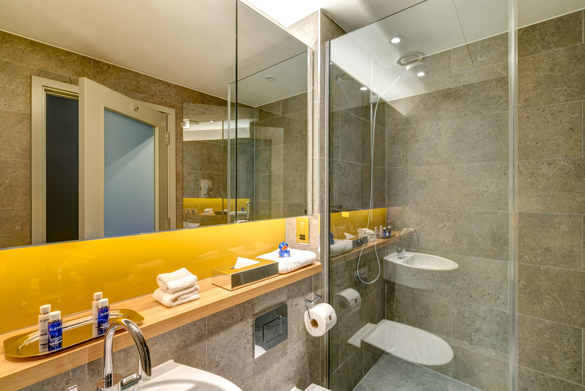 Bathroom with sink and walk-in shower