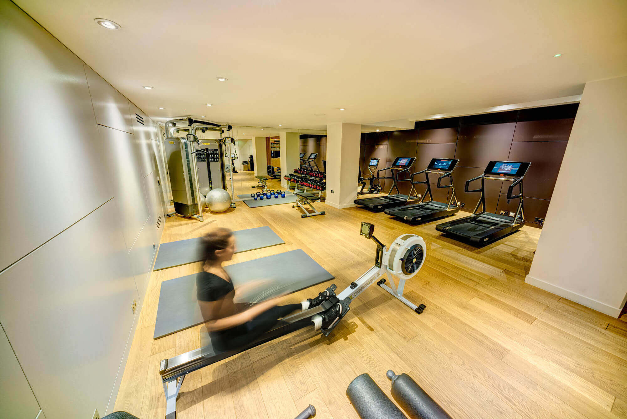 Guest using rowing machine in gym